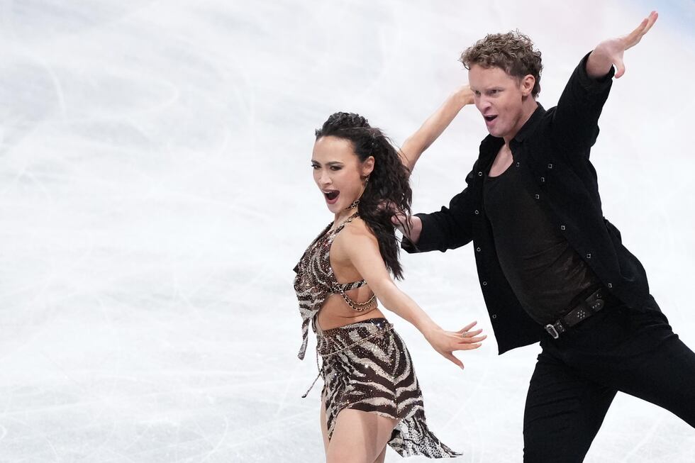FILE - Madison Chock and Evan Bates, of the United States, compete in the ice dance's rhythm...