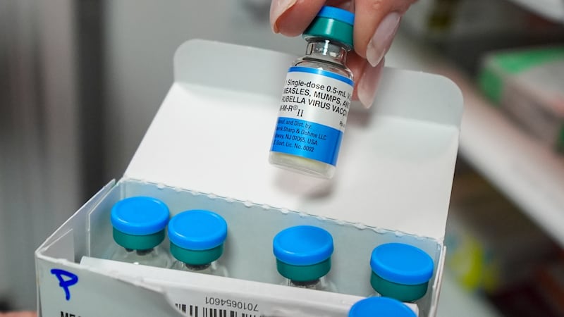 FILE - Vials of the measles mumps and rubella (MMR) vaccine are displayed in Lubbock, Texas,...