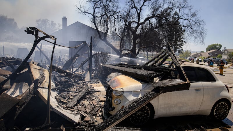 The Sandy Fire damages a property Monday, May 18, 2026, in Simi Valley, Calif.